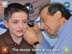 Photograph of a doctor examining a child's ear with an instrument.