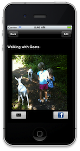 Screenshot of a photo of a small child walking down a wooded lane with two goats.