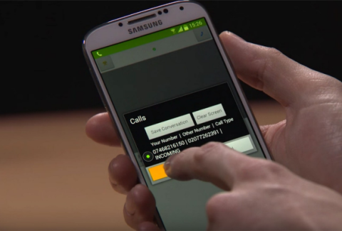 A person holds a Samsung smartphone and hitting a button on a pop-up menu that says "Calls" with various options.
