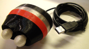 Oval-shaped device with two white knobs on one end, a red band around the center, and connected to a USB cable.