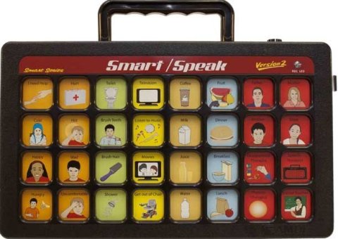 A black rectangular device with 32 message icons with text above such as "brush hair" and "cold," and a handle on the top.