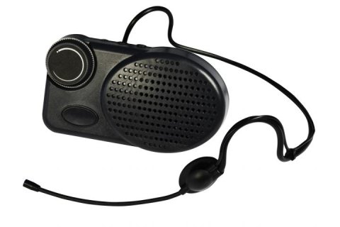 A black rectangular device with a volumne knob on the left, a speaker on the right and a headset with microphone connected via an output on top.