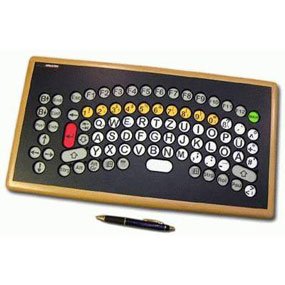 Semi circular arrangement of colored keys on a black board with stylus to demonstrate scale. 