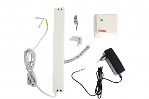 Two white rectangular objects with corresponding parts and a black power cord.