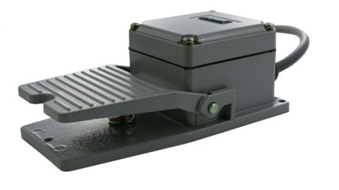 A gray foot pedal with a gray cord attached.