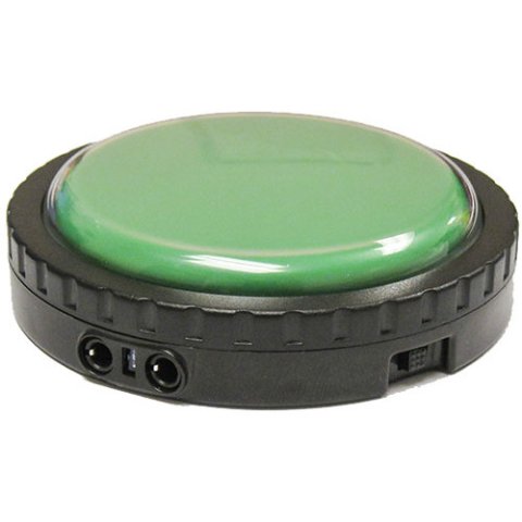A round switch with a green surface and a black base.