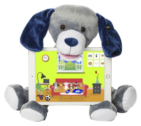 Bluebee Pal Pro Hudson The Puppy is a plush toy puppy grey with velvety black ears. He is sitting with his chin on an iPad and with the bottom of the device on his 2 front paws.