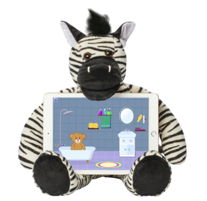 Riley the Zebra is black and white zebra-striped with a black tuft of hair between ears that are black on the outer side and white on the inside. He has a black muzzle and footpads. He is sitting with an iPad in his lap which has a screen showing a child-appropriate drawing of a bathroom with a bear in the tub.