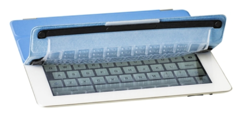An iPad that has a silicone cover with key imprints half-way rolled back, revealing an online screen keyboard.