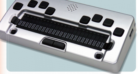 A silver very rectangular Braille keyboard is shown with 8 keys in 2 arcs on the top, 2 keys in a row with the touch keys, 1 key below those on the right and left each, and 2 keys in the center. There is a speaker at the top middle between the arcs.