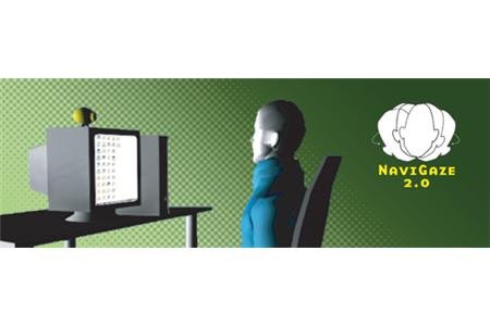 A man seated on a chair in front of a computer and web cam with the name NaviGaze written. 