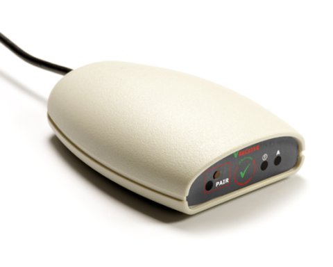 White mouse-like device with inputs on front side and connector on back side.
