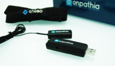 enPathia system consisting of a corded sensor, a black ribbon-like material strap, and a USB drive.