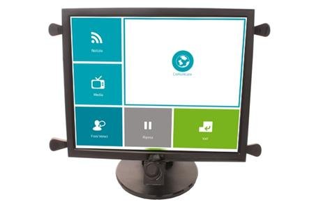 A Desktop screen with a camera attached to the bottom. The menu shown has large and simple buttons for Internet, Pause, Files, Bluetooth, TV, Contact.