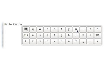 A white on-screen keyboard with the words "Hello Caribou".