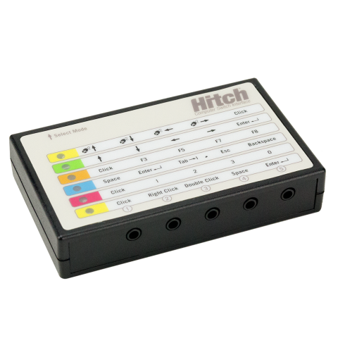 Rectangular white and black device with multi-colored labels.