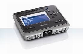 Front view of a rectangular device with an LCD screen, control buttons, and audio jack.