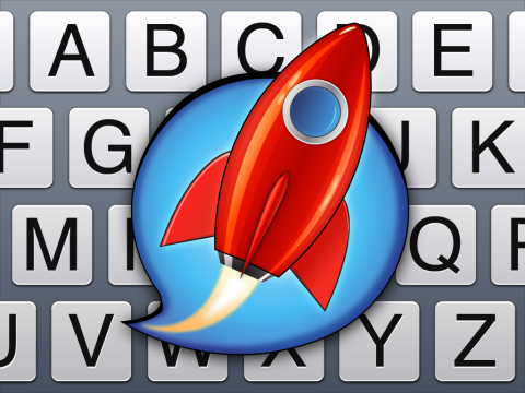Square picture of partial keyboard overlaid with a red rocket in the center enclosed in a blue "speech bubble."