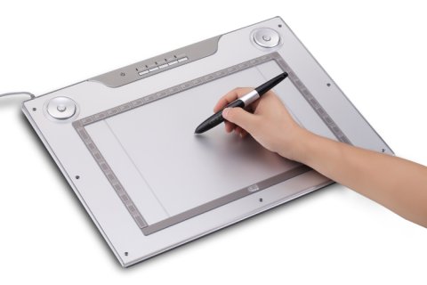 white tablet in use with a hand holding a stylus