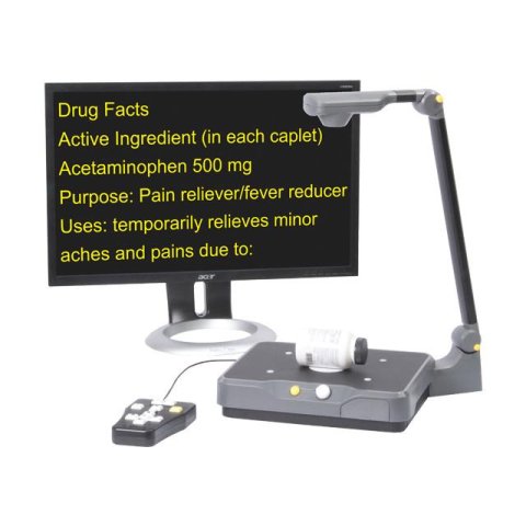 A stand magnifier with a camera at the top, and beneath, a platform base for placing materials on. Next to it, a large monitor is displaying content in high-contrast, yellow-on-black font.