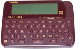 Computer keyboard beneath a built-in medium-sized computer screen, burgundy in color and with the words written above and below the screen: Franklin Holy Bible.