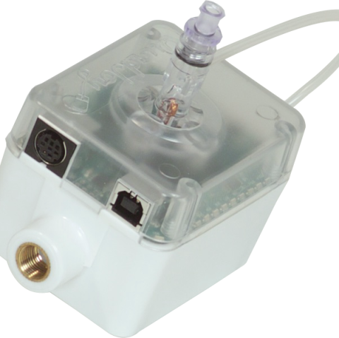 Small, rectangular box with three cable ports on its side and a vertical mouth tube tethered to a white cord that is attached at the center of the top face. 