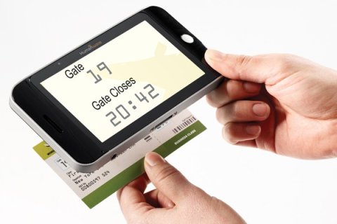Handheld magnifier assisting the user read a ticket.