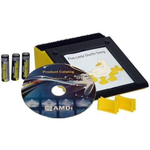 A yellow rectangular device with a screen framed in black; a product catalog CD and batteries are also featured.