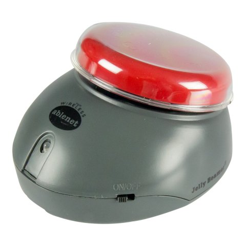 A dark grey device with a red switch button mounted at an incline.
