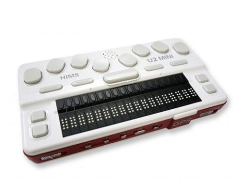 A compact white, rectangular device with light grey keys and black Braille cells.
