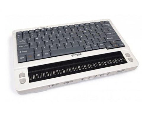 A white, rectangular device with grey keys and black Braille cells. This model features a QWERTY keyboard.