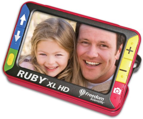 Rectangular handheld with display screen in center showing a picture of a smiling man and a young girl's face, with control buttons at either end and an integrated stand.