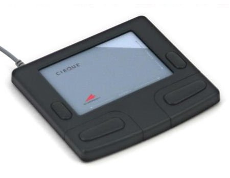 Flat, rectangular, black device with touchpad in center and four buttons on either side of touch pad and two on the bottom.