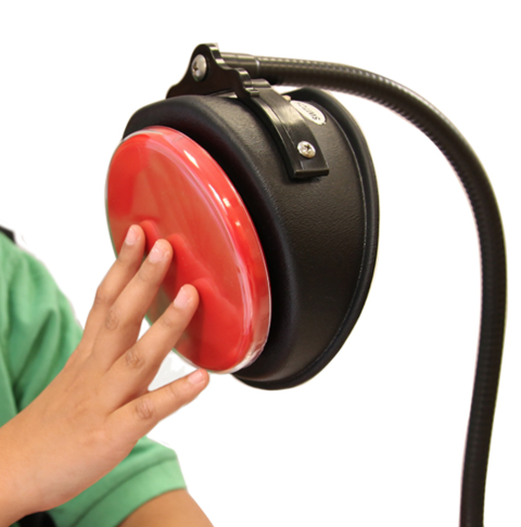 A large, round, and red switch mounted on a "gooseneck" mount, with a user shown pressing it.