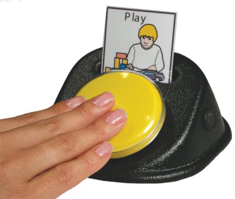 A yellow button positioned at an angle on a black, wedge-shaped device with a slot to hold a paper card with a word and an image.