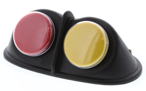 Two large yellow and red buttons on a small black raised device.