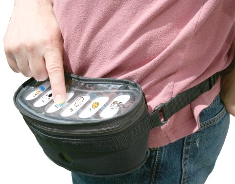 Black pouch strapped around the waist of a person with a white flat surface and six buttons with icons.