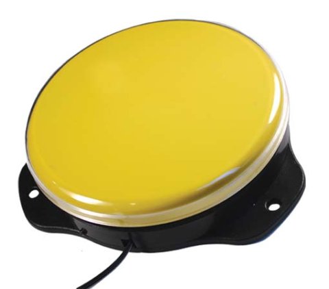 A large, round, yellow switch, with a flat top and black colored base. 