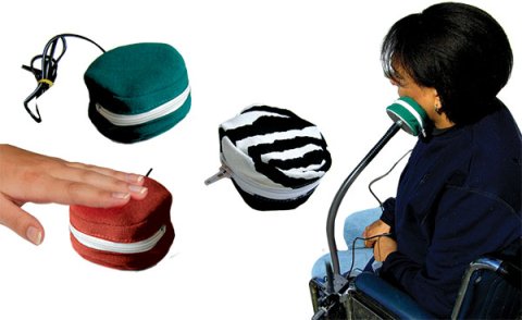 Three soft zippered pouches with a hand pressing on one of them. A woman sitting in a wheelchair pressing the side of her head against a soft pouch attached to a flexible arm clamped to the wheelchair's arm.