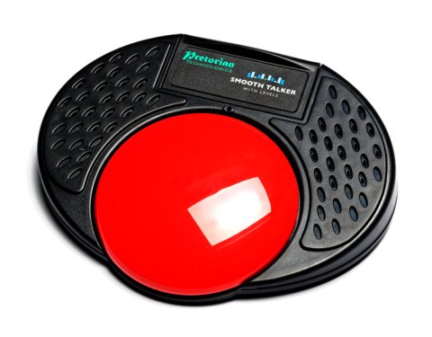 Close up view of red button embedded on black, oval speaker.