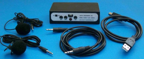 A rectangular device with two microphone ports, a 3.5mm port, and an on/off switch. The accompanying cables and microphones are also pictured.