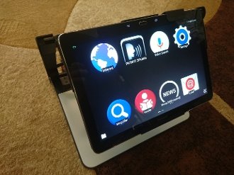 Video Magnifier with portable stand. The screen displays a "home" menu screen with various app icons.