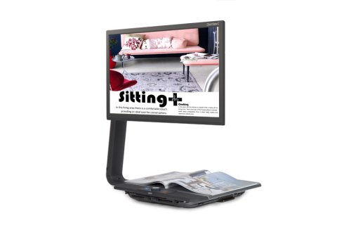 Large display monitor with a platform base underneath for placing documents and materials to magnify. The screen is displaying a zoomed-in view of a magazine.
