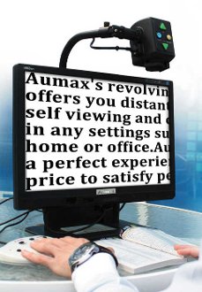 Monitor with magnifier mounted at the top with controls to zoom and a light attached.