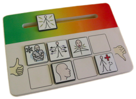 Tiles representing feelings to be input on a scale ranging from green to red on rectangular, wooden board.