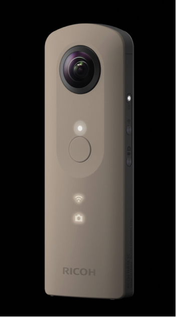 Thin, long, and rectangular device with camera lens embedded at the top. Small control buttons are aligned vertically underneath the lens, and there are control buttons along the right edge as well. Shown is the V model in dark grey.