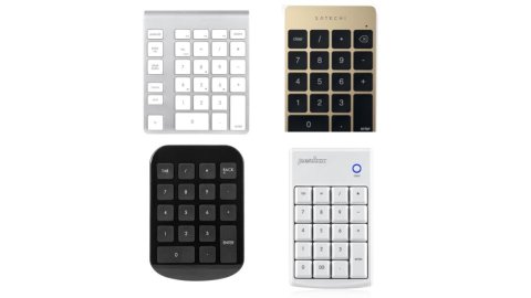 Various models of numeric keypads. They resemble a small calculator, but feature standard keyboard keys. One model has an additional column of page navigation keys on the left-hand side. Two models are silver; one is gold; and the fourth is black.