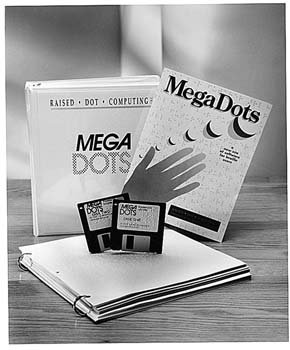 A black and white image of the software packaging and two floppy disks of the software.