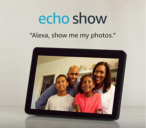 A black, medium-sized tablet device with an image of a family on screen. A quote reads, "Alexa, show me my photos."