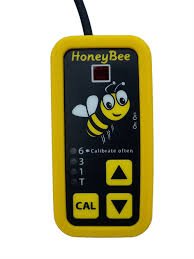 Vertical rectangular device with a yellow border and black face that has a cartoon bee image on the top half and control buttons on the lower half.